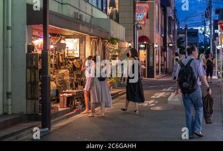 Foreign tourists at Shimokitazawa street neighborhood, Tokyo, Japan at night. Stock Photo