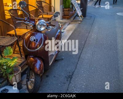 Vespa scooter in the street sidewalk of Shimokitazawa neighborhorhood, Tokyo, Japanp Stock Photo