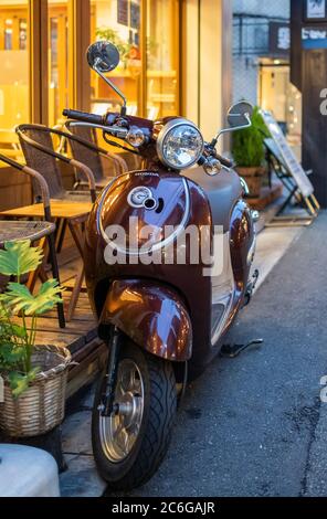 Vespa scooter in the street sidewalk of Shimokitazawa neighborhorhood, Tokyo, Japanp Stock Photo