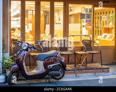 Vespa scooter in the street sidewalk of Shimokitazawa neighborhorhood, Tokyo, Japanp Stock Photo