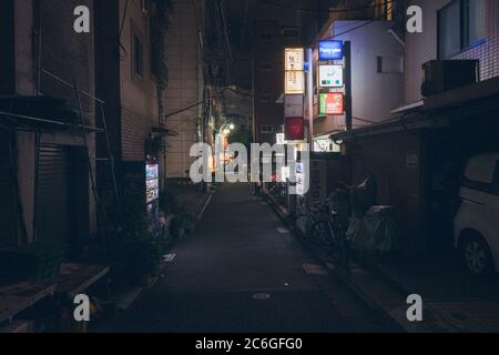 Street in the dark, city of Tokyo Japan.