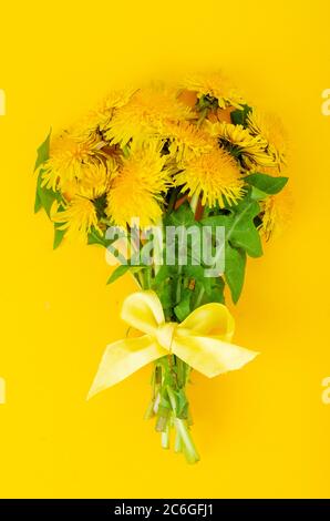 beautiful Bouquet of blooming yellow dandelions. Photo Stock Photo