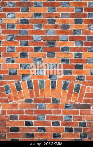 Red and black brick wall pattern. Avebury, Wiltshire, England Stock Photo