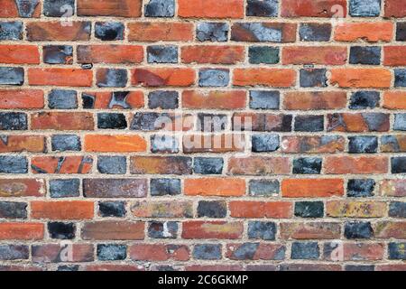 Red and black brick wall pattern. Avebury, Wiltshire, England Stock Photo