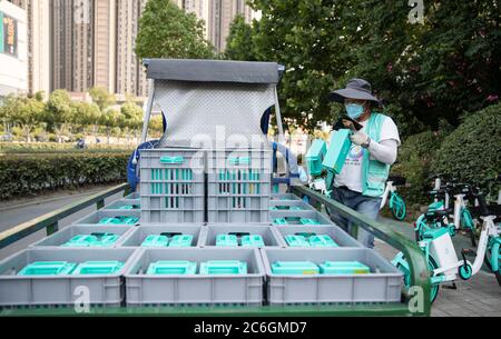 A shared bike battery changer is changing batteries for a shared bike in Hefei city, east China's Anhui province, 4 June 2020. Stock Photo