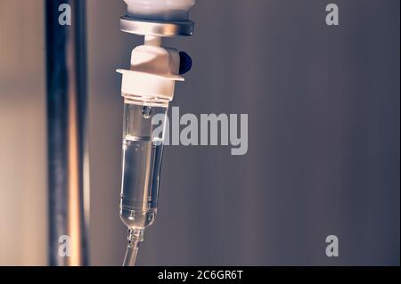 Saline solution iv bag with syringe line hanging on wall Stock Photo by  ©Mumemories 254338814