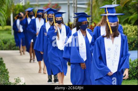 Graduation during Corona Virus / COVID 19. The graduates had to wear masks during the ceremony. They also had to practice social distance Stock Photo