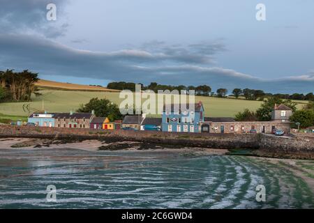Roberts Cove, Cork, Ireland. 10th July, 2020.Early morning light illuminates the picturesque seaside village of Roberts Cove, Co. Cork, Ireland. The weather for the day is dry with sunny spells and a just a few scattered showers with highs of 15 to 17 degrees. Credit; David Creedon / Alamy Live News Stock Photo