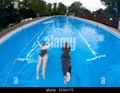 Cambridge, UK. 10th July 2020 The UK government announced that outside swimming pools can open from Saturday 10th July 2020. Jesus Green Lido in Cambridge hopefully is one of those, pictured here in busier times.  Credit: Headlinephoto/Alamy Live News Stock Photo