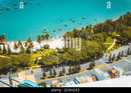 Panoramic coastal Vung Tau view from above, with waves, coastline, streets, coconut trees and Tao Phung mountain in Vietnam Stock Photo
