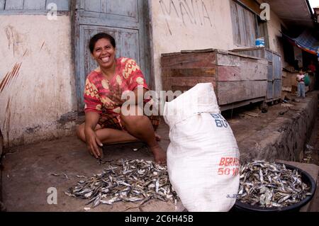 Woman selling long fish, Market, Kalabahi, Alor, Indonesia Stock Photo -  Alamy