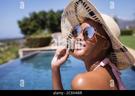 Woman wearing hat and sunglasses Stock Photo