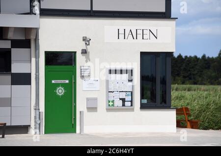 Usedom, Germany. 07th July, 2020. The harbour master's office in the harbour of the city of Usedom. The water hiking rest area with 70 places and a wide range of leisure activities was completed in 2019. The Usedomer-See-Zentrum is located on the eastern outskirts of the town on Lake Usedom, which can be reached from the Szczecin Lagoon via the access road between the West and East Klüne. Credit: Stefan Sauer/dpa-Zentralbild/ZB/dpa/Alamy Live News Stock Photo