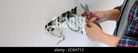 Electrician working on the electrical installation of a house Stock Photo
