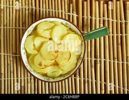 Scalloped Potato And Smoked Fish Pot, Smoked haddock and potato gratin Stock Photo