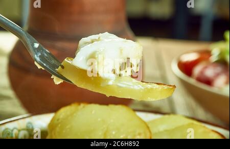 Scalloped Potato And Smoked Fish Pot, Smoked haddock and potato gratin Stock Photo