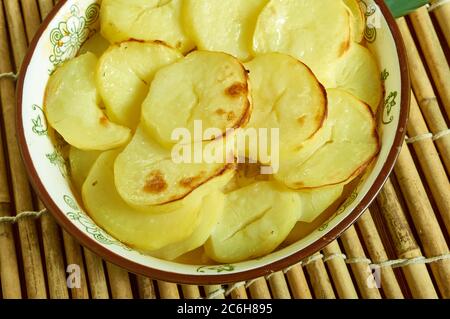 Scalloped Potato And Smoked Fish Pot, Smoked haddock and potato gratin Stock Photo