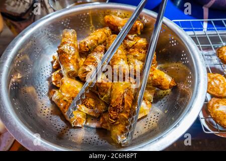 Fried spring rolls, night market, central Vientiane, Laos Stock Photo