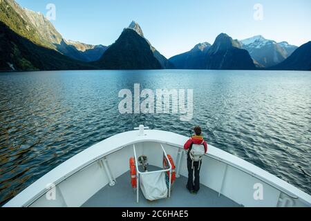 Traveller with beautiful scenic of milford sound in fiordland national park new zealand. Stock Photo