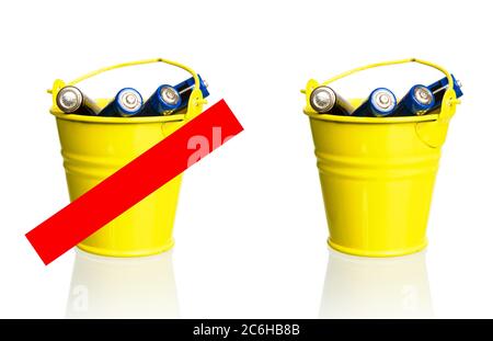 concept trash bin with batteries thrown into it and prohibition sign on a white background Stock Photo