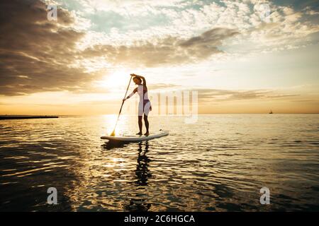 Woman On A Stand-Up Paddle Stock Photo