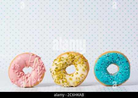 Download Three Colorful Donuts On Yellow Paper Bag Banner Close Up Top View Stock Photo Alamy PSD Mockup Templates