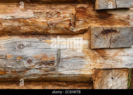 Natural background pattern of a log wall. Wooden log cabin wall. Stock Photo