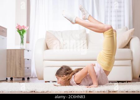 Strong athlete doing casual workout at home Stock Photo