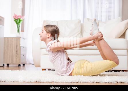 Strong athlete doing casual workout at home Stock Photo