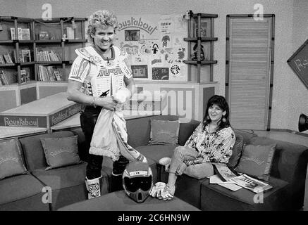 Former 500cc World Motocross rider Patrick Boniface with Emma Freud on the set of children's TV show Roustabout Stock Photo