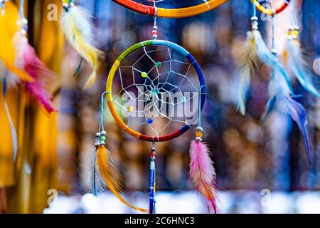 Beautiful colorful dream catcher for sell in souvenir shop on blurred background Stock Photo