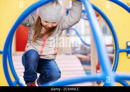 Happy girl playing at the playground Stock Photo