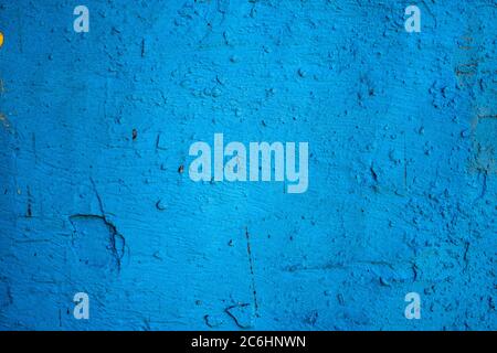 old wall with dry and cracked blue paint Stock Photo