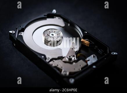 Closeup of hard drive storage disk on black table Stock Photo
