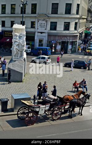 Vienna, Austria - April 24th 2011: crowd of people in front of the memorial against war and fascism is the work of the Austrian sculptor Alfred Hrdlic Stock Photo