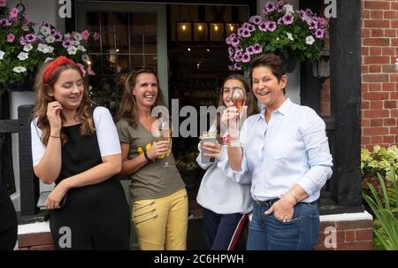 Ditchling Sussex UK 10th July 2020 - A toast for Dame Vera Lynn as residents line the streets of Ditchling as the funeral procession of Dame Vera Lynn passes by today . Singer Dame Vera Lynn who was known as the Forces Sweetheart died at the age of 103 on June 18th  : Credit Simon Dack / Alamy Live News Stock Photo