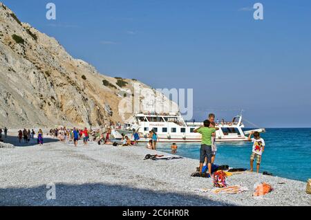 Skiathos, Greece - October 03, 2012: Unidentified people enjoy a trip to isolated  Lalaria beach, the beach is reachable only by boat and a preferred Stock Photo