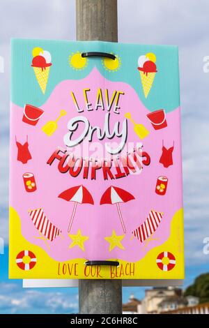 Bournemouth, Dorset UK. 10th July 2020. New Leave only Footprints colourful signs along the promenade to try and get the message across and avoid tons of litter and rubbish just left on the beaches at Bournemouth. Leave only Footprints Love our Beach. Credit: Carolyn Jenkins/Alamy Live News Stock Photo