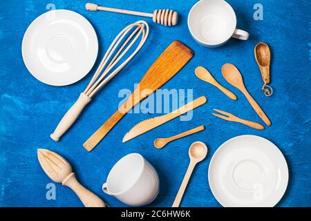 Kitchen utensils on a textured classic blue background in a top view Stock Photo