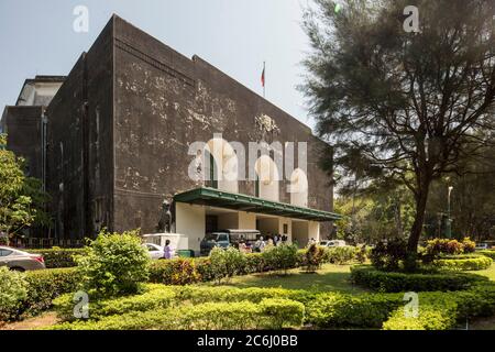 Oblique view of west elevation from north west of Convocation Hall, with three arched-doorways designed by Thomas Oliphant Foster. Yangon University, Stock Photo