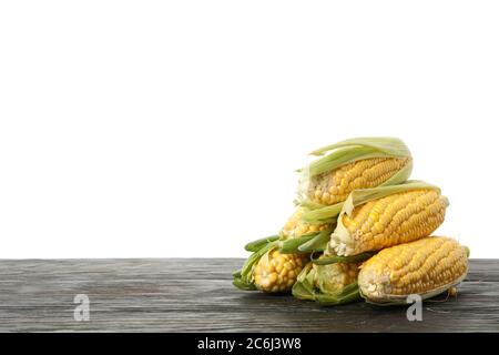 Corn on wooden table isolated on white background Stock Photo