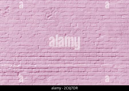 Pink brick wall. Loft interior design. Pink paint of the facade. Stock Photo