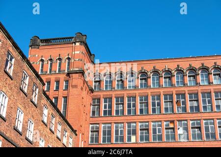 Tall old Derbyshire mill building Stock Photo