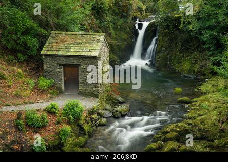 The Grot summer house and Rydal Falls in the gardens of Rydal Hall in the Lake District National Park, Cumbria, England. Stock Photo