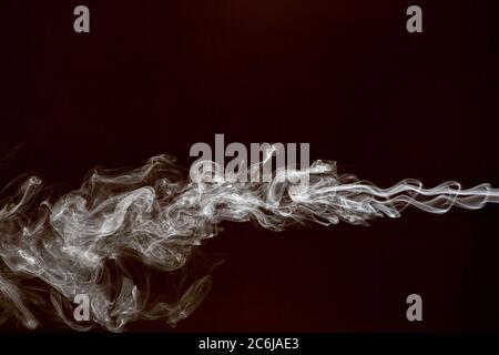 Smoke isolated on dark background Stock Photo