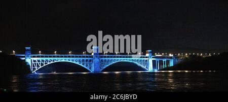 Britannia Bridge, Bangor, North Wales, UK. The bridge that the Menai Straits between Bangor and Anglesey illuminated to celebrate 72 years of the NHS Stock Photo