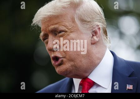 Washington, United States. 10th July, 2020. President Donald Trump responds to a question from the news media as he walks to Marine One on the South Lawn of the White House in Washington, DC on Friday, July 10, 2020. Photo by Shawn Thew/UPI Credit: UPI/Alamy Live News Stock Photo