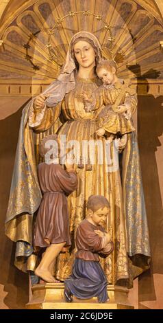 BARCELONA, SPAIN - MARCH 3, 2020: The baroque polychome carved satatue of Madonna in church Basilica de la Merced from 19. cent.. Stock Photo