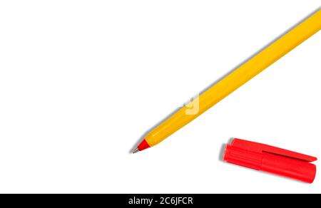 Yellow pen with red cap on white background. Above mockup texture Stock Photo