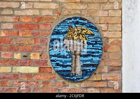 MURANO, ITALY - SEPT 26, 2014: Mosaic of the lion of Saint Mark on the wall. The Lion of Saint Mark is the symbol of the award of the Venice Film Fest Stock Photo